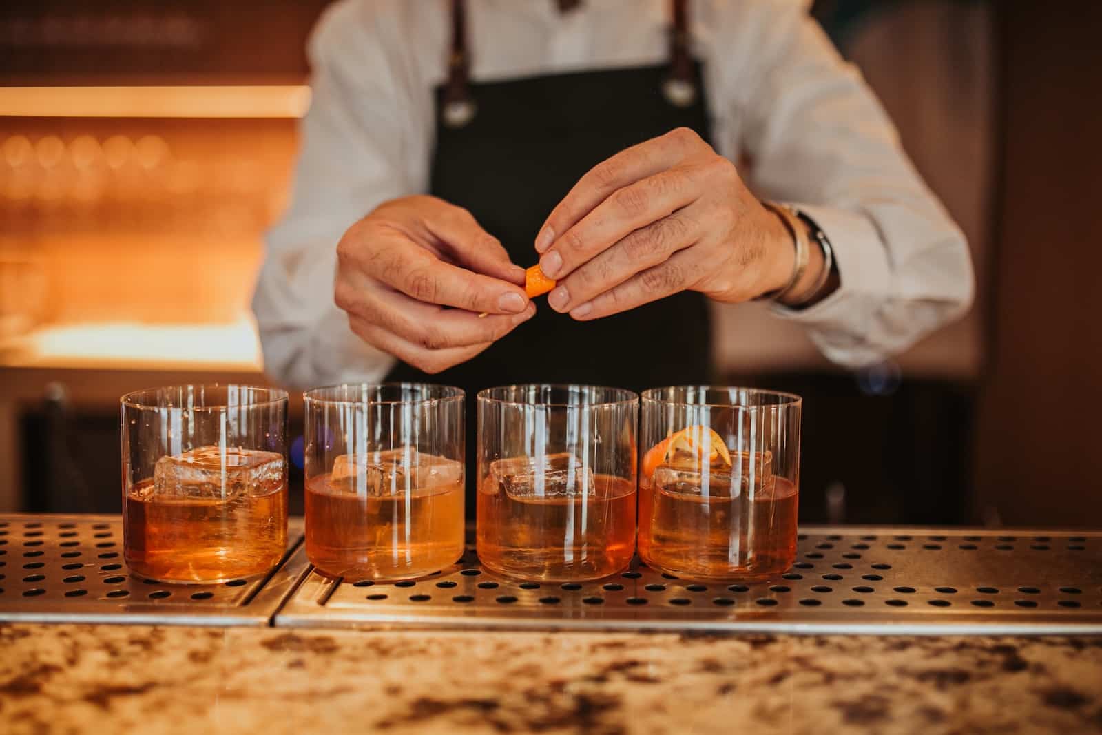 Dine at Nearby Wisconsin Supper Clubs 1 Enjoy an old-fashioned cocktail, a supper club staple, at any of the Wisconsin supper clubs. This bartender is preparing four drinks for his patrons.