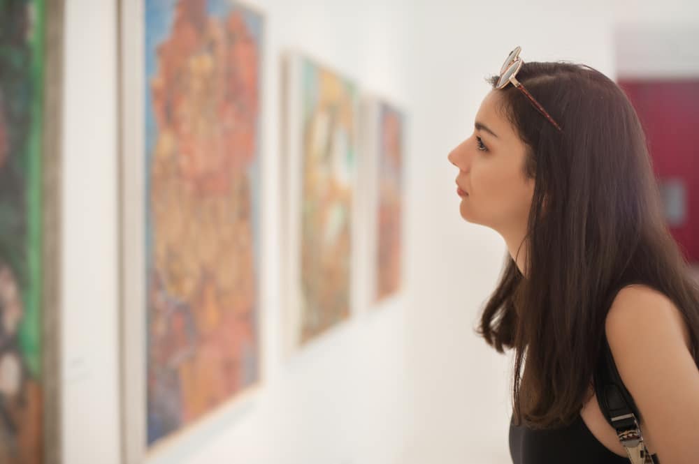 Woman studying one of the exhibits at the Leigh Yawkey Woodson Art Museum in Wausau