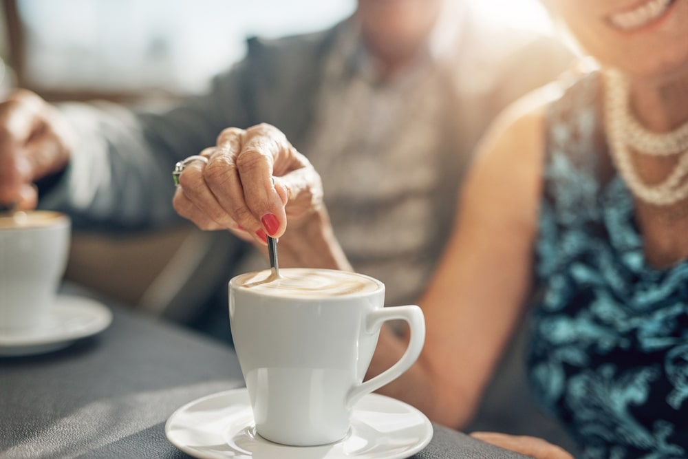 Couple enjoying a cup of coffee during their Couples Getaway Wisconsin